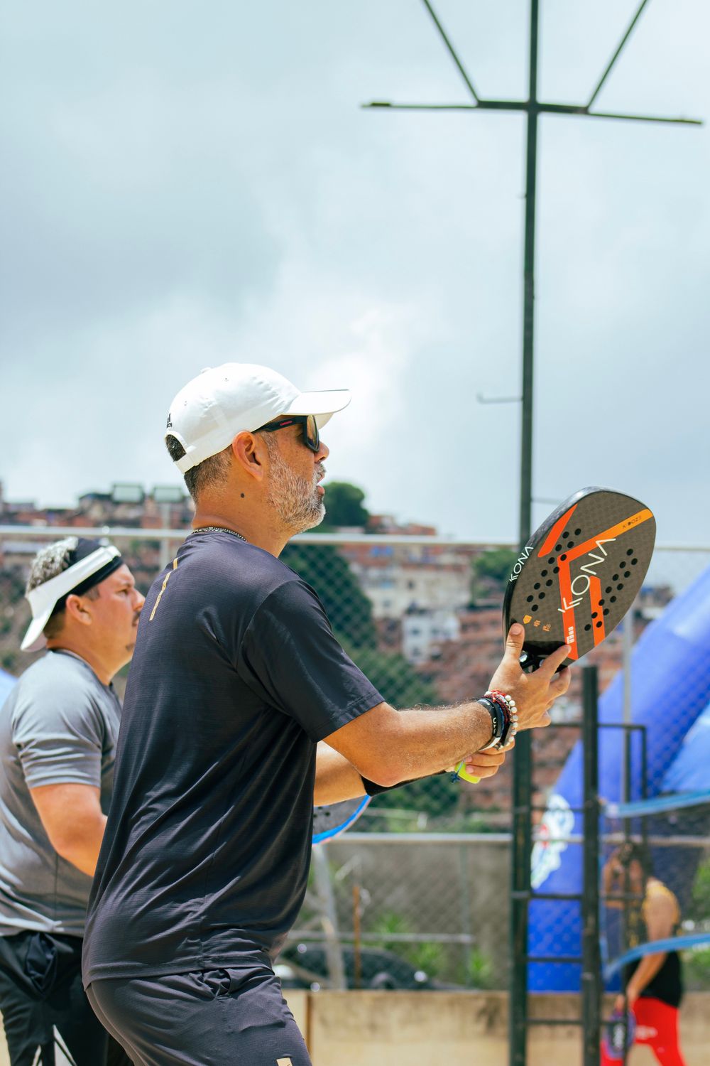 Padel players holding rackets — illustrative stock photograph